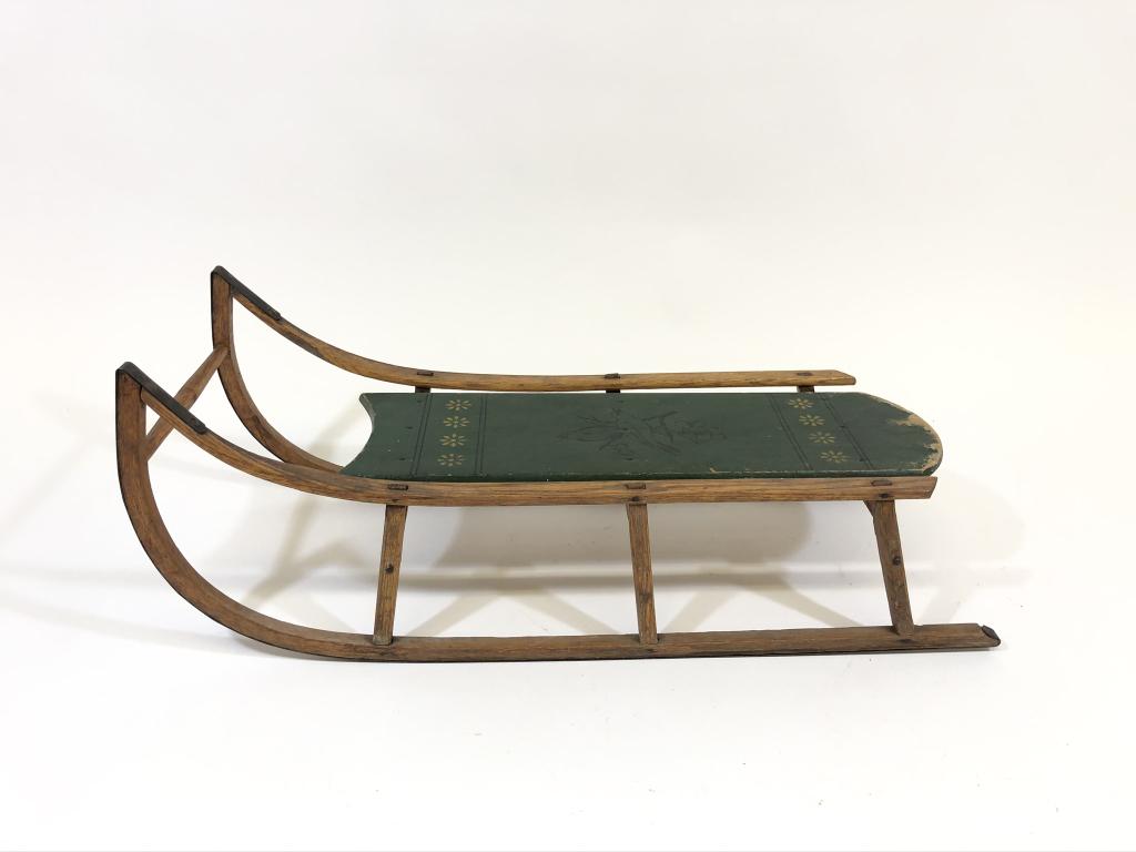 Paris Manufacturing Co. Painted Early Wooden Sled: Deck is painted green with birds. Model No. 54 . Solid and in good condition. 33 inches long and 13 inches wide.