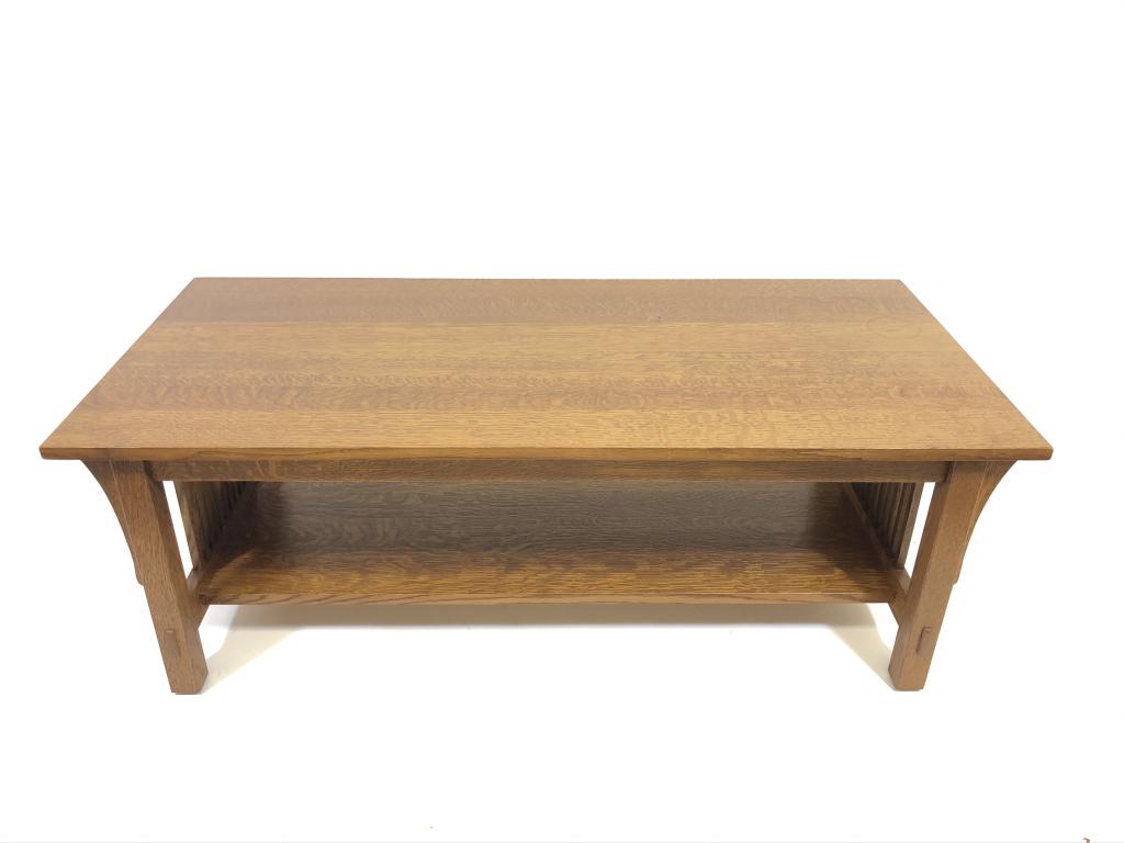 Stickley Coffee Table: 22 inches x 48 inches x 17 inches. Spindled sides, medium brown finish, made in Fayetteville, NY. No. 89-757. Mortised construction. Very good condition.