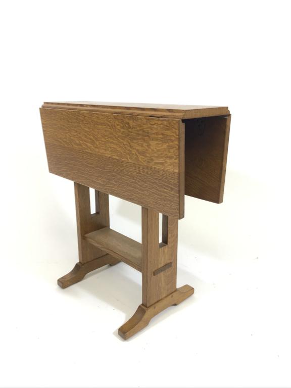 Stickley Drop Leaf Drink Stand: medium brown finish. Made in Fayetteville, NY. 1982. Top is 24 inches square with leaves up and it is 24 inches tall. Shoe foot base, mortised stretcher. Top has some water stains and is not perfect.