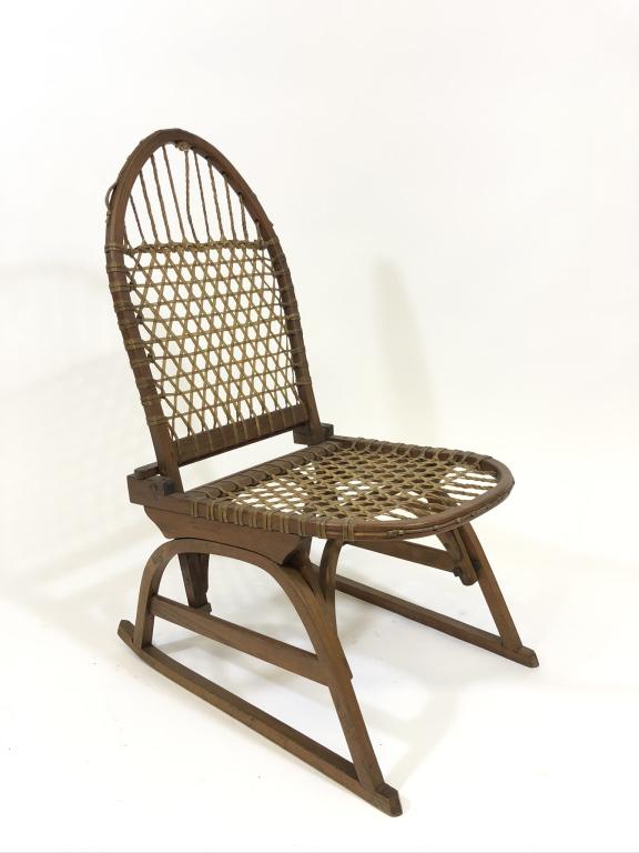W.F. Tubbs Co. Snoshu Folding Canoe Chair: made in Norway, Maine with original label and rawhide seat. Webbing in good shape. Wood split on back of top bend. Seat height is 13 inches.