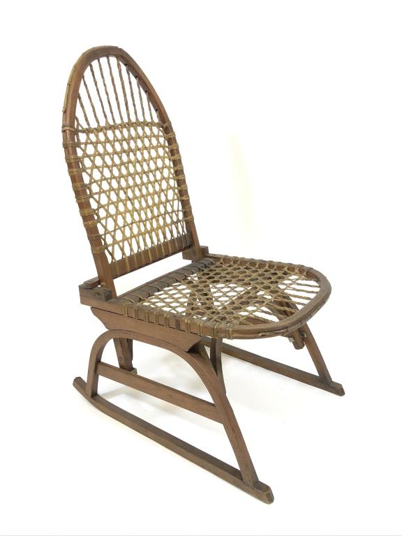 W.F. Tubbs Co. Snoshu Folding Canoe Chair: made in Norway, Maine with original label and rawhide seat. Webbing in good shape. It is structurally sound and solid but there is a break in the wood on top of the back of the seat. Seat height is 13