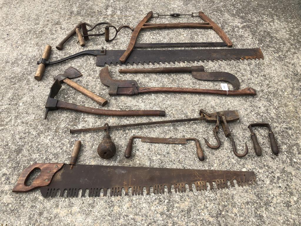 Collection of Adirondack Logging & Caretaker Tools: From an Adirondack Camp in Indian Lake, NY. Includes: Ice saw, buck saw, cross cut saw, steelyard scales, draw shave, pulp hooks, adze and other tools.
