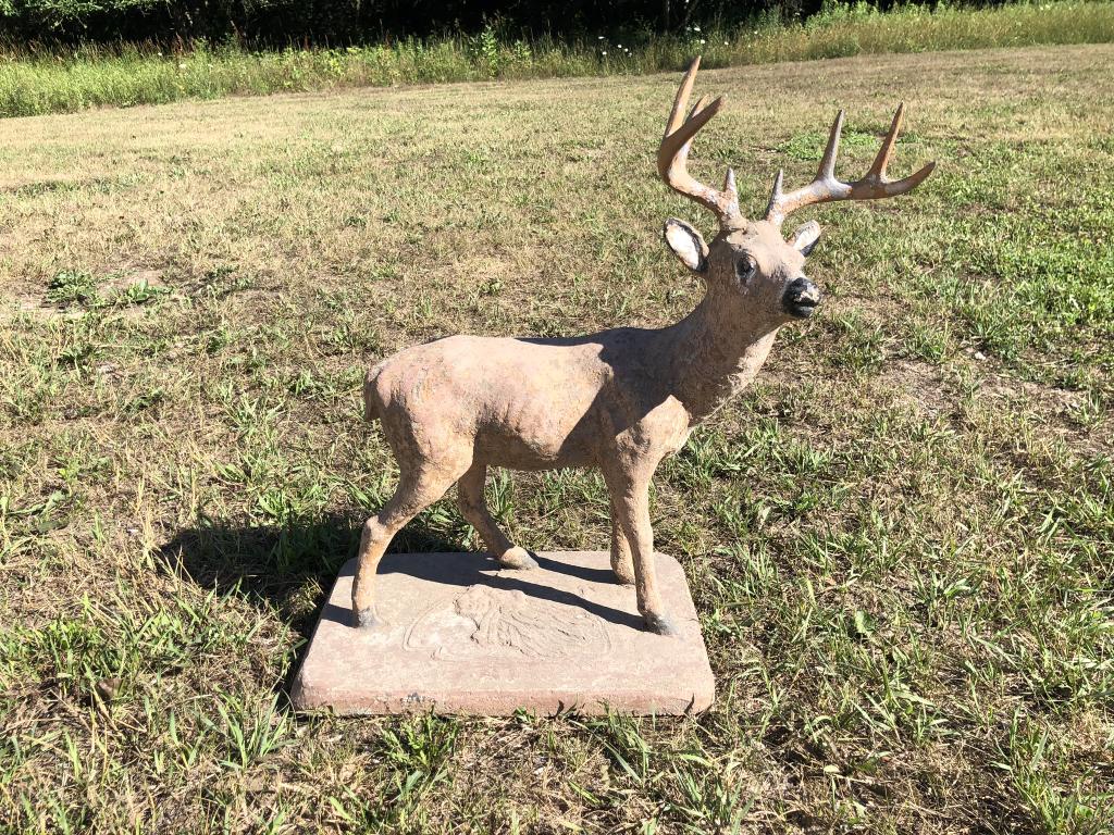 Whitetail Buck Sculpture: 8 point buck. Deer and base are made out of concrete and the antlers are cast aluminum. 25 inches tall. Indian Chief molded on the base. Good age and worn patina.