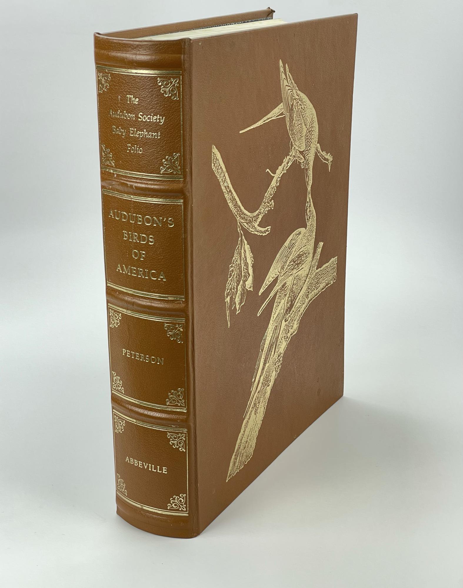 Audubon Birds of America Book, Baby Elephant Folio: special edition, numbered 946 of 2500. Baby elephant folio size. Hardbound in leather and signed by authors Roger Tory Peterson and Virginia Marie Peterson. Complete with all colored plates. Book has 