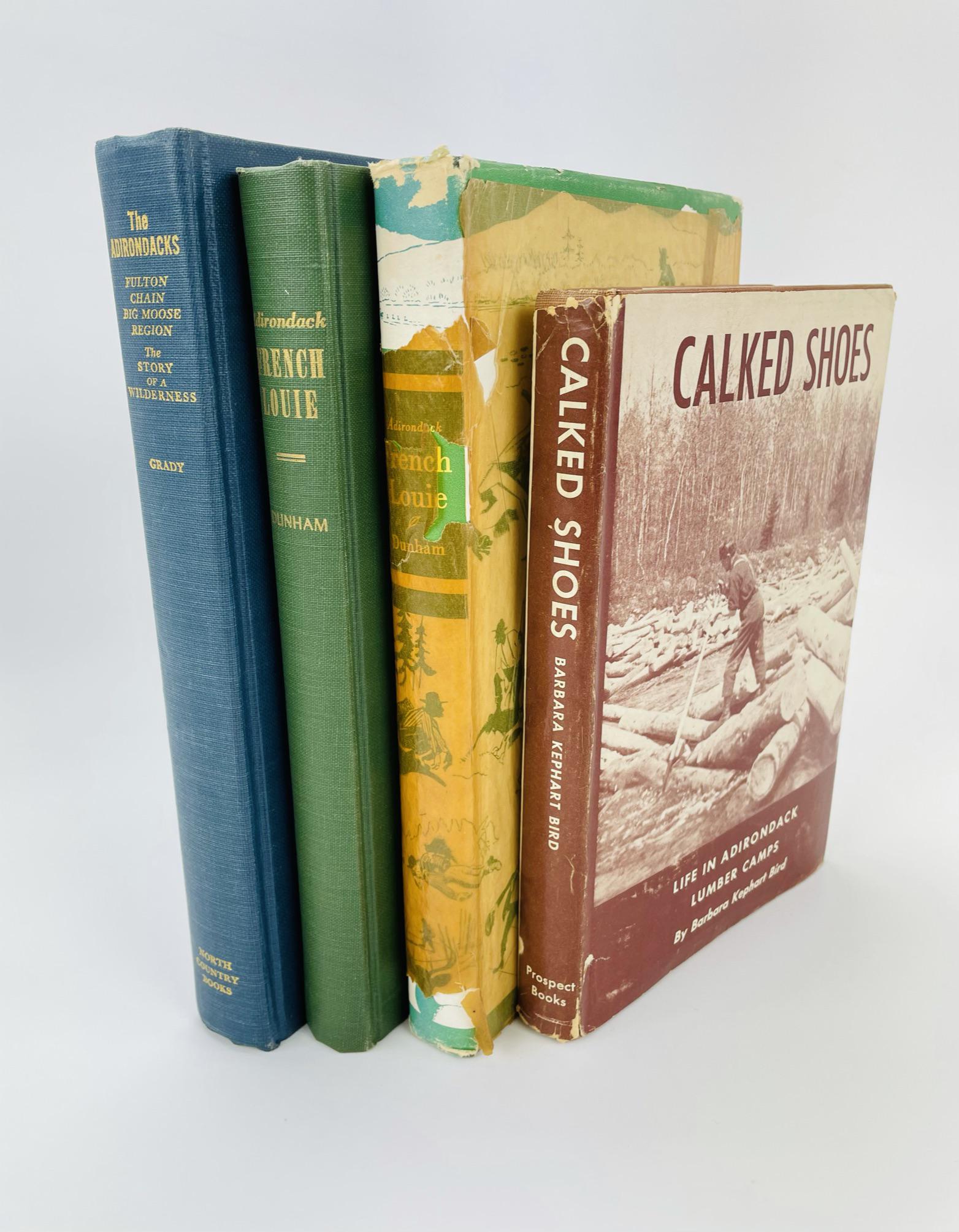 4 Hardcover Adirondack Books: "The Adirondacks: Fulton Chain - Big Moose Region" by Joseph Grady, 1966 and 2 "Adirondack French Louie" by Harvey Dunham, 1952. "Calked Shoes: Life in the Adirondack Lumber Camps" by Barbara K. Bird.