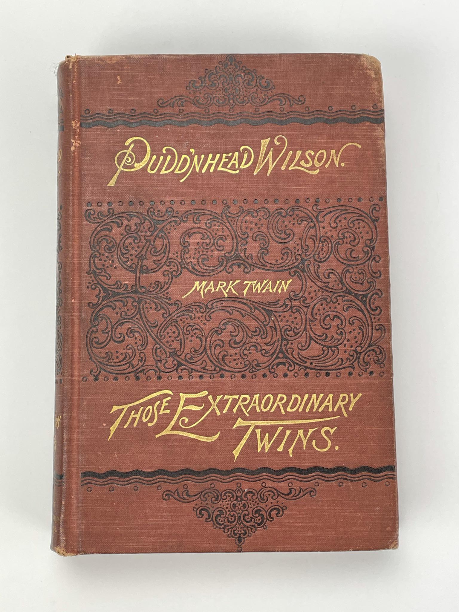 The Tragedy of Pudd'nhead Wilson by Mark Twain: 1894. With marginal illustrations, first edition, hard cover has gilt lettering.