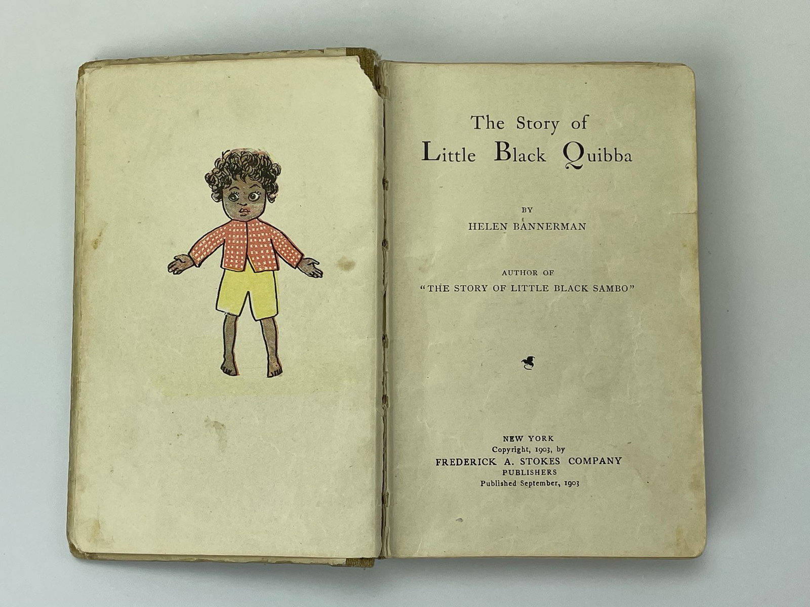 Bannerman’s Little Black Quibba 1903.: Helen Bannerman, The Story of Little Black Quibba. New York: Copyright, 1903, by Frederick A. Stokes Company Publishers, Published September 1903. 24mo, bound in the original cloth-backed pictorial bo