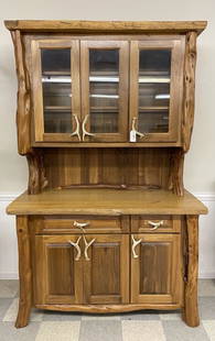 Norseman Designs West Wall Hutch: Western style by John Gallis, Cody, WY. Walnut hutch with juniper legs and trim, 2" thick solid oak top and whitetail antler pulls, finely crafted with light up top section. Two piece unit in excellen