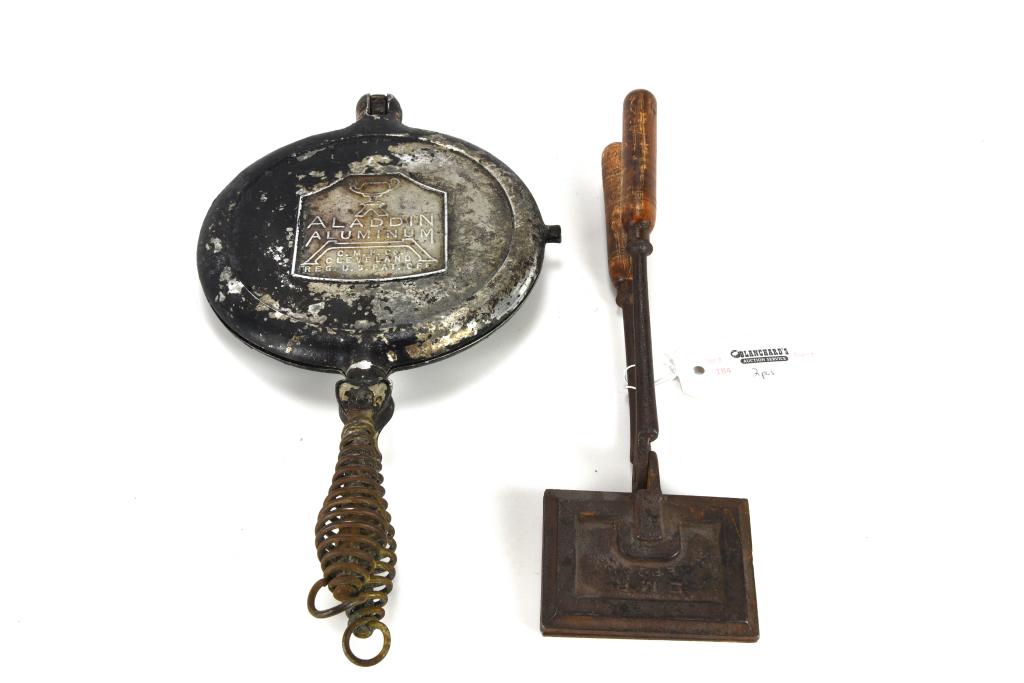 Cast Iron Waffle Iron & Alladin Waffle Mold: Waffle iron was photographed and used in Miller's Kitchenware Antique Price Guide on Page 208. It is 12" long, circa 1900. From the collection of Marilynn Brass, Cambridge, MA. Marilynn is one of the