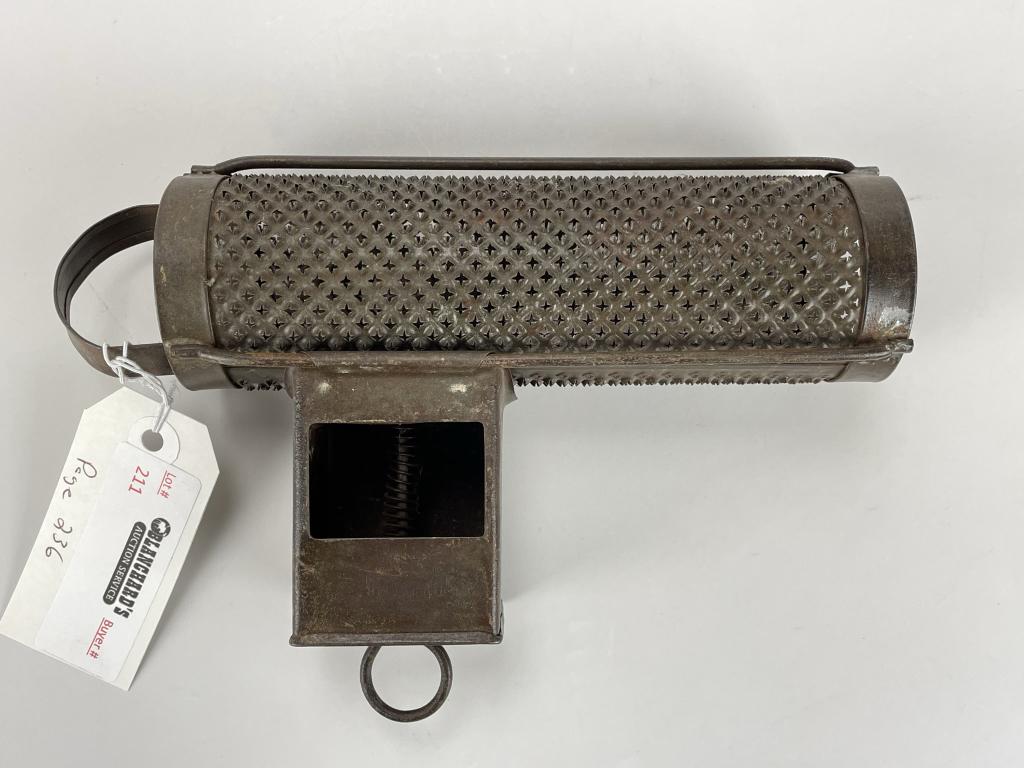 Tin Chocolate Grater: early 20th century, 8 3/4" wide. In excellent condition. This item was photographed and used in Miller's Kitchenware Antique Price Guide on Page 236. From the collection of Marilynn Brass, Cambridge,