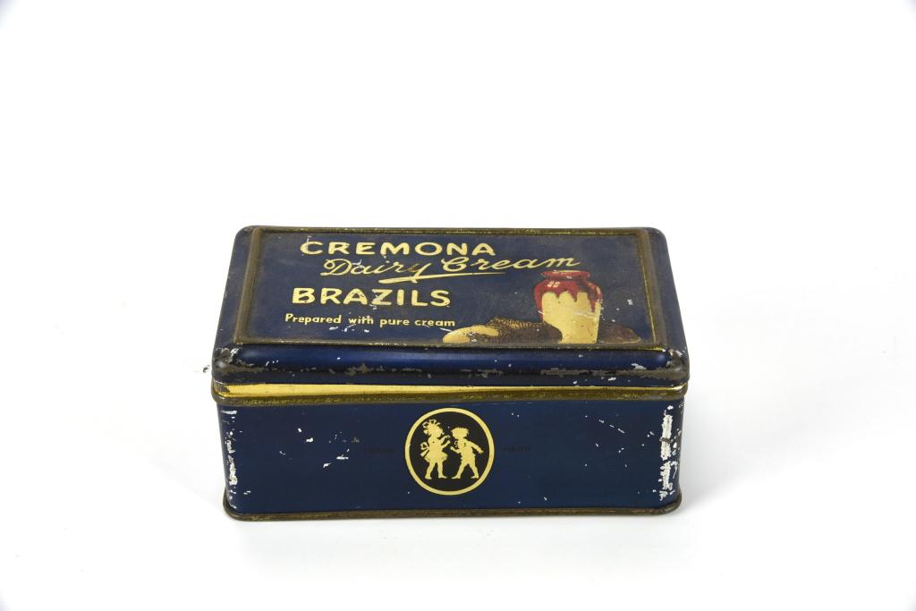 Cremona Dairy Cream Brazils Tin: Circa 1920's. 5 3/4" wide. Hinged lid. This item was photographed and used in Miller's Kitchenware Antique Price Guide on Page 120. From the collection of Marilynn Brass, Cambridge, MA. Marilynn is on