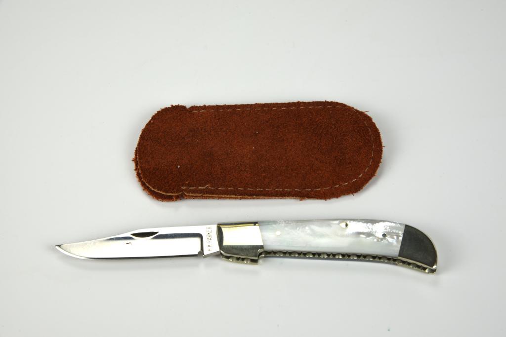 HK Parker Folding Knife: 5 3/4” open, 2 7/16” blade, marked “HK Parker”, Ex condition, appears unused, unmarked suede sheath.