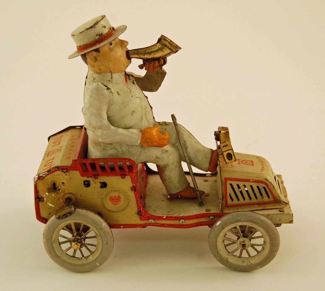 German tin wind up toy Lehmann Tut Tut: Patent 1903. Replaced right arm