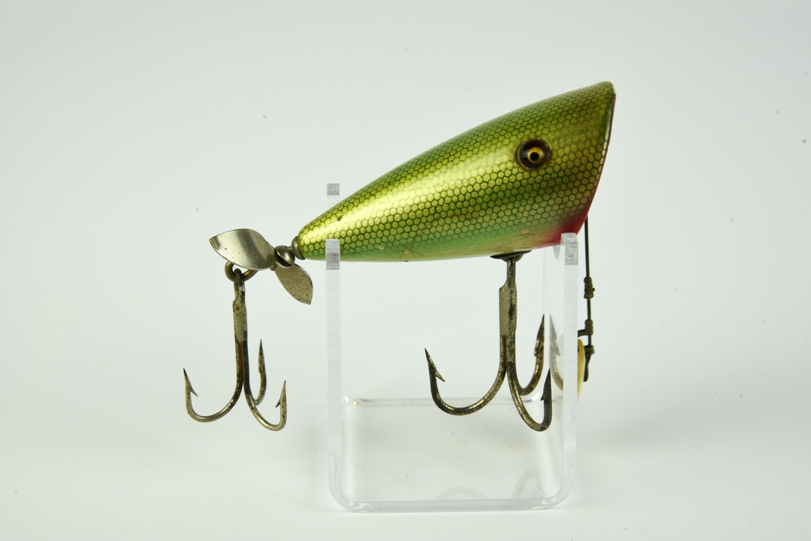 Homarth Jiggilo “Big Mouth Plunker”: Scarce short production lure dating from the 30’s, shiny “green gar” scale finish, good glass eyes, just under 3”, about Ex- condition.