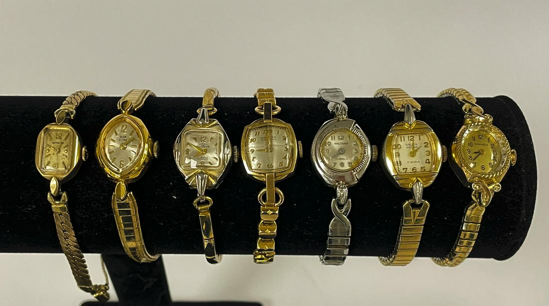7 Ladies Wrist Watches: maker's include: Elgin, Mondaine, Waltham, Caravelle, Wittnauer and 2 Gruen. All watches sold as is.