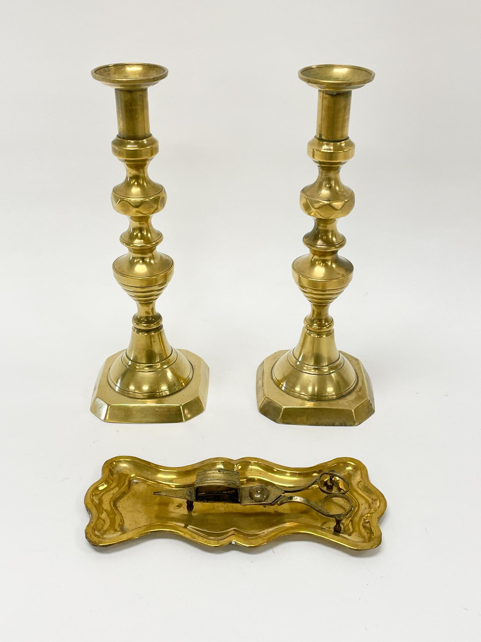 Pair of Early Brass Push up Candlesticks (1 of 3)