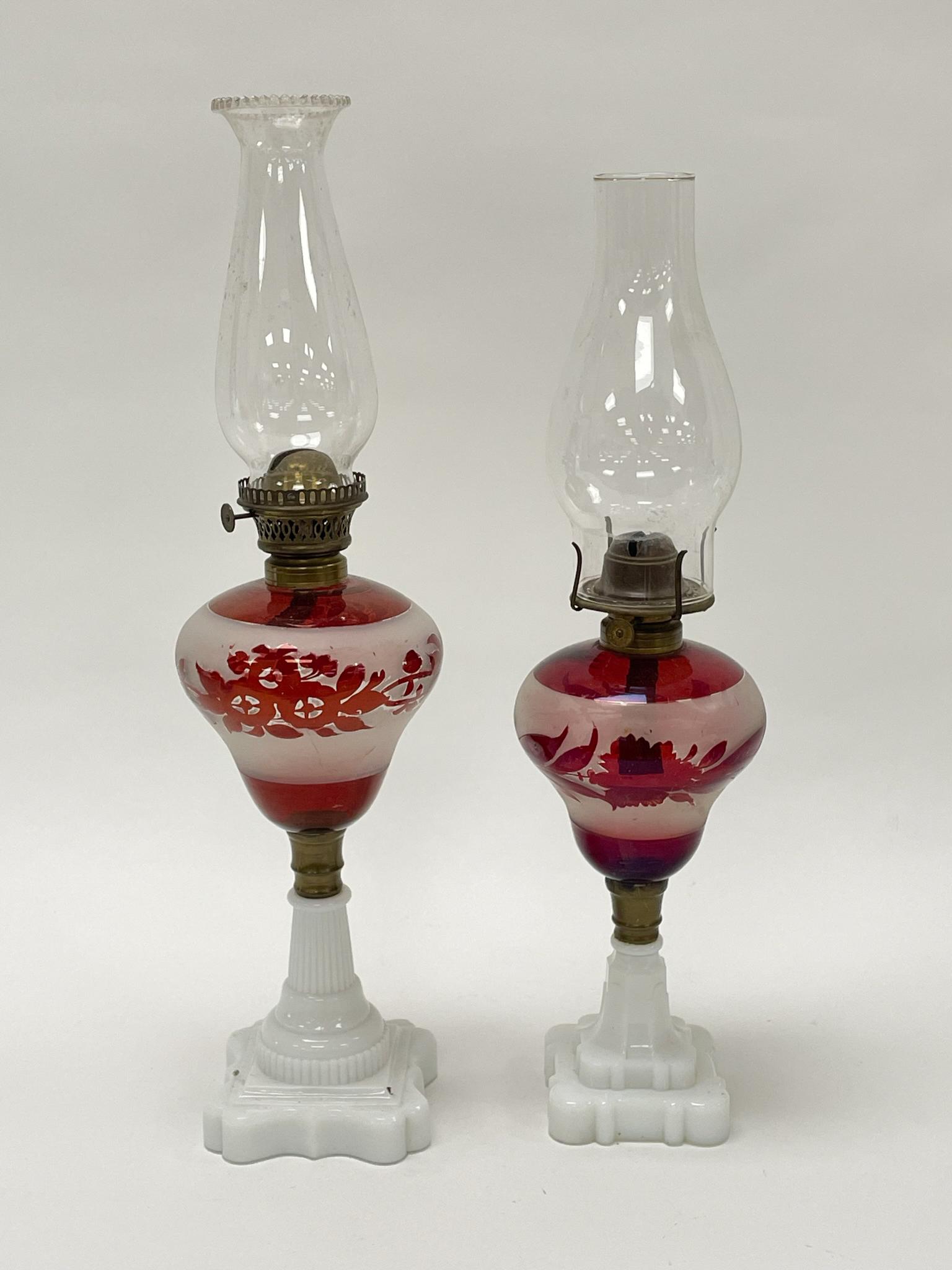2 Cranberry and Frosted Glass Oil Lamps: Late 1800s. 22" tall and 20 1/2" tall. From the Estate of Carlton Stickney, County & Town Historian and Lifetime Collector.