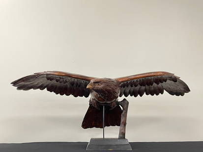 Black Forest Full Body Flying Eagle: 34 1/2" wing span. Stands 13" tall with glass eyes and good age. Quality carving with fine detail and proportions. Repair across tail feathers.