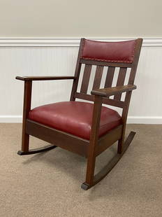 Quarter Sawn Oak Mission Rocker: with red leather seat and padded back rail. Structurally sound, unmarked, medium to dark brown finish is in good condition.