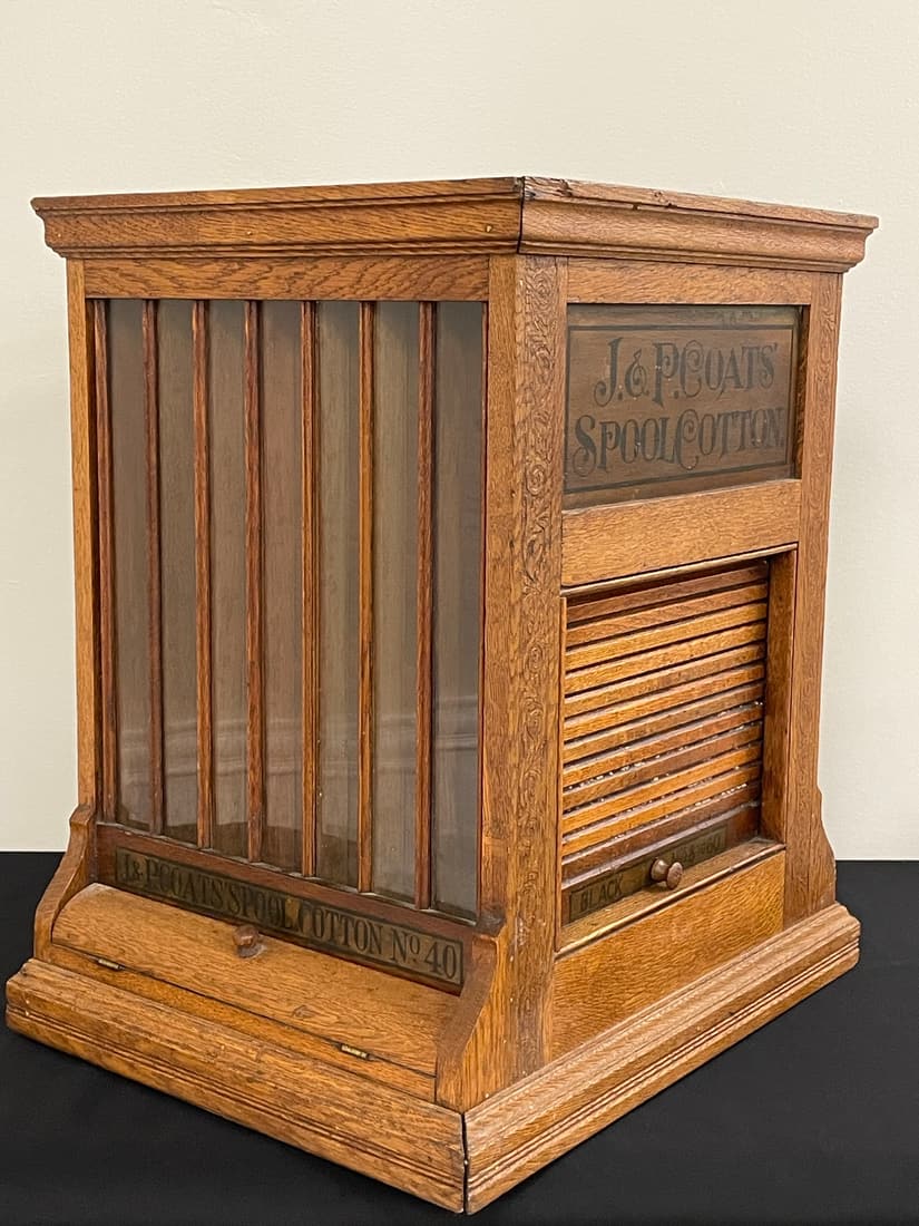 J.P. Coats Country Store Revolving Spool Cabinet: Rare model with advertising on all 4 sides, original varnish in good condition. 20" x 16" x 23"