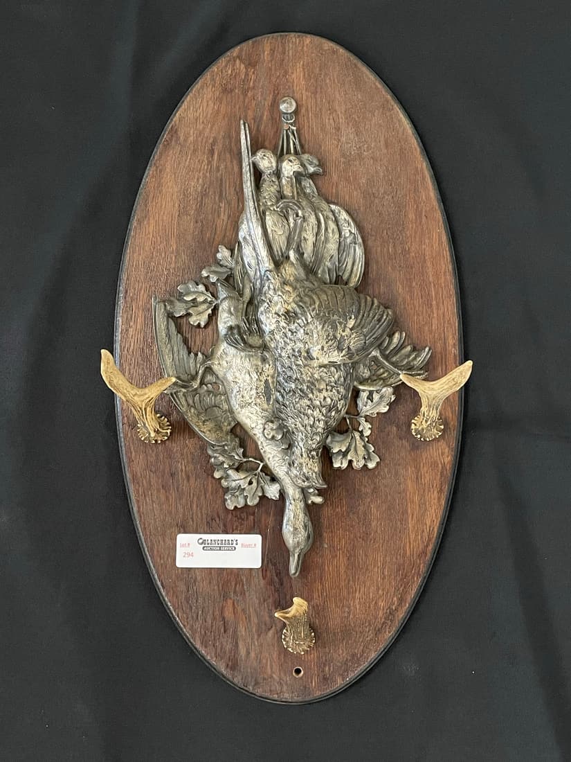 Hanging Game Casting: on oval oak plaque with antler hooks. 22" long
