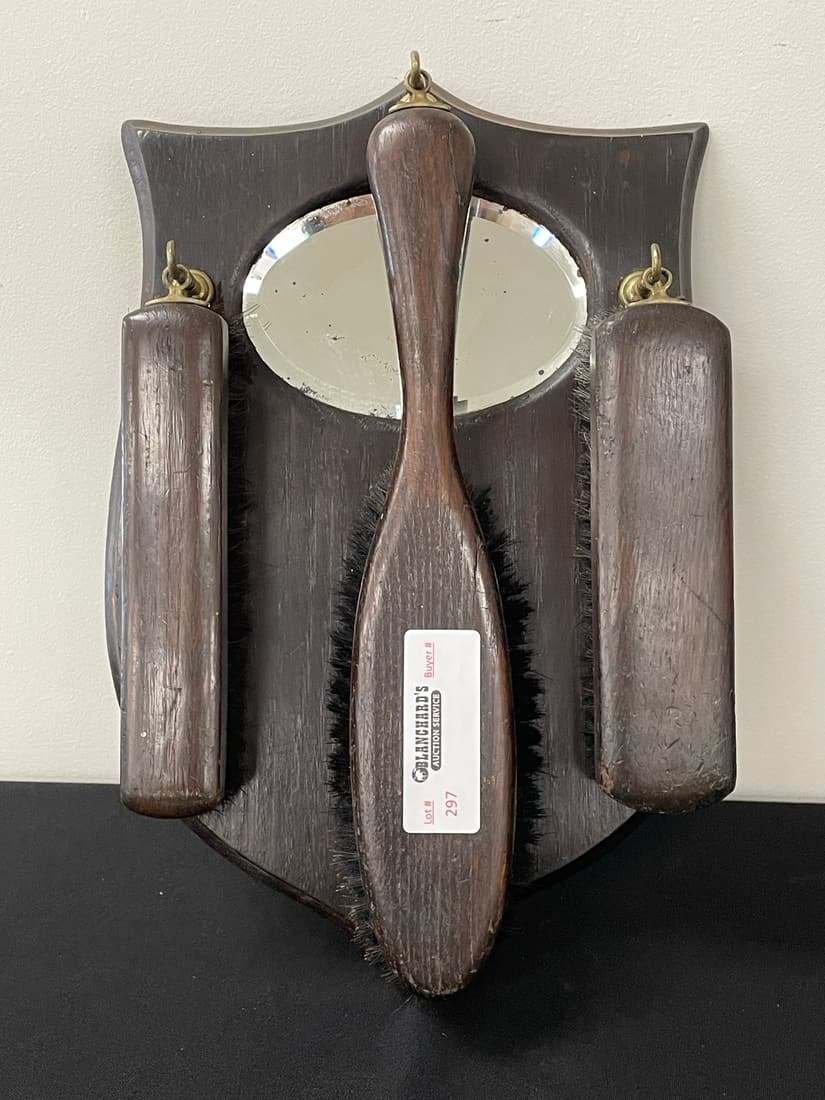 4 Piece Oak Hanging Brush Set: shield plaque with oval mirror and 3 brushes. 13 1/2" long.