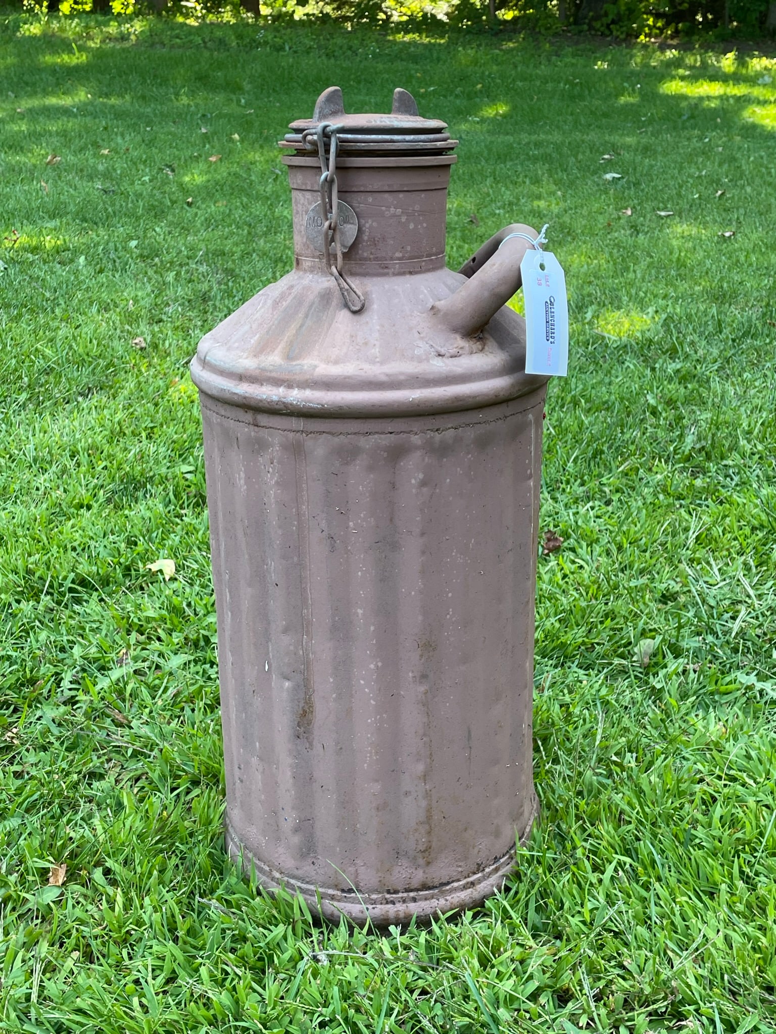 Socony 5 Gallon Steel Oil Can: All original and in good condition. Socony embossed on the neck of the can. The can was made by The Davis Welding Company with patent dates embossed on the lid top. From the 1920s. The chain securing