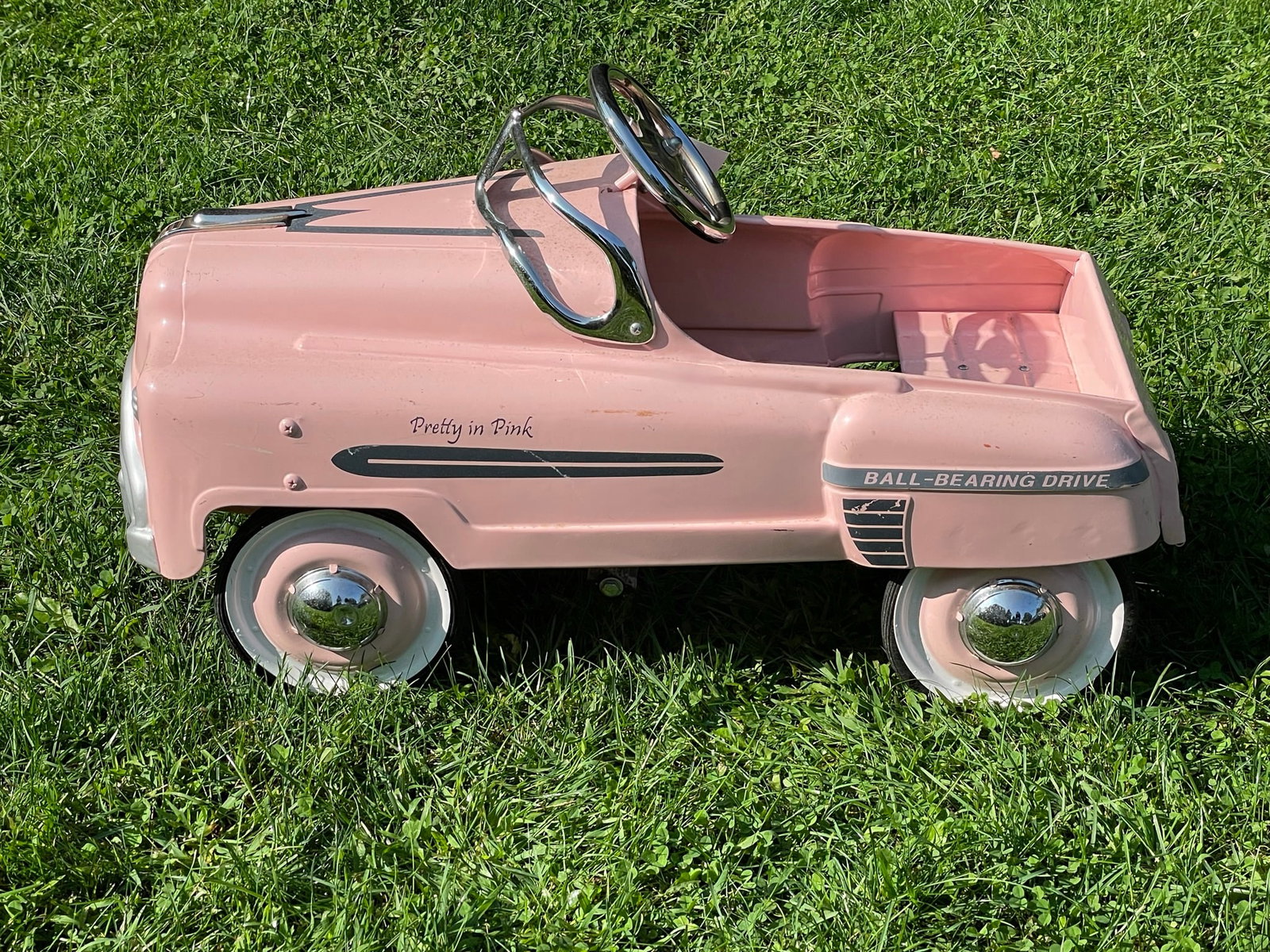 Pretty in Pink Metal Peddle Car: good condition with some minor scratches and scuffs.