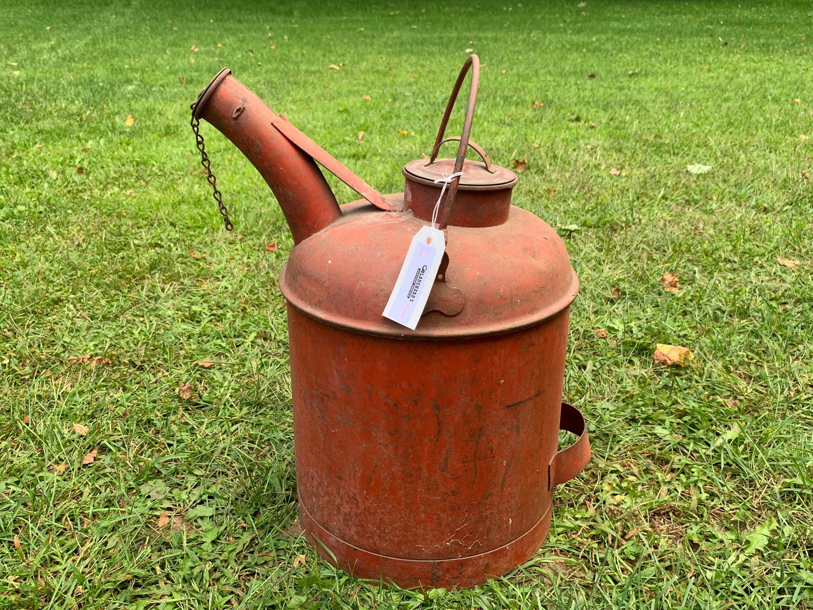 Vintage Red Oil / Gas Can: manufactured of heavy steel, there are no markings to identify the can maker. The can is in very good condition, all original, with a nice spout, lid and chain. Estimated size 4 gallon capacity.