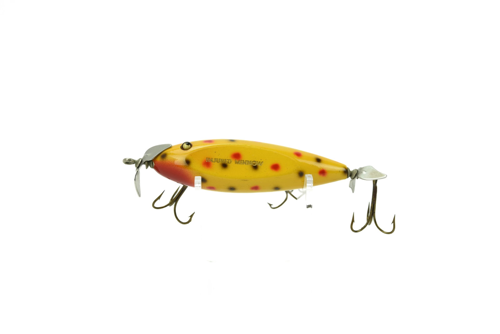 Creek Chub Injured Minnow Special: Finished in vivid yellow with black/red spots and bright red ribs. Early model has good glass eyes and the gold "Injured Minnow" side stamp, grading shiny VG+/Ex-, with light wear, a thin tail chip, a