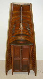 Barney Bellinger Wine Server Canoe Cabinet: Inlaid original Tiffany tile and surfaces covered with original molesworth leather. Made out of an early wood canvas canoe. 39" wide x 83 1/2" tall.