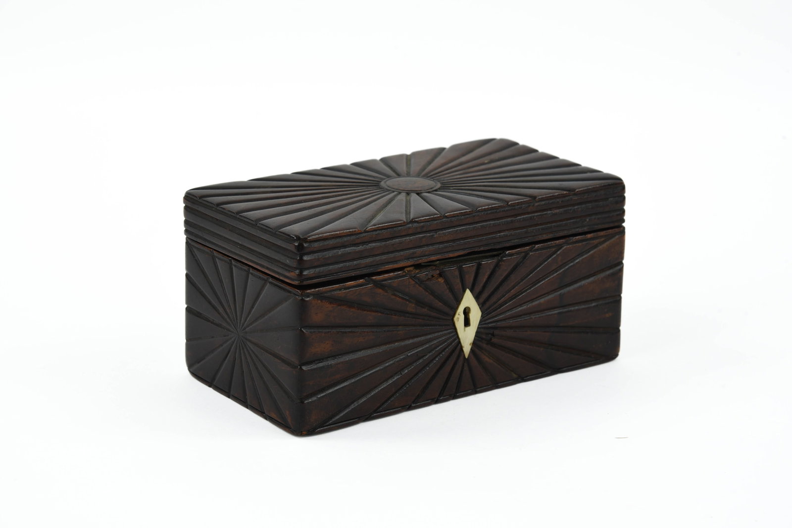 Finely Carved Dresser Box: with starburst decoration and a diamond shaped bone escutcheon. Remnants of old green paper liner, excellent detail. 6 1/2" x 3 1/2"