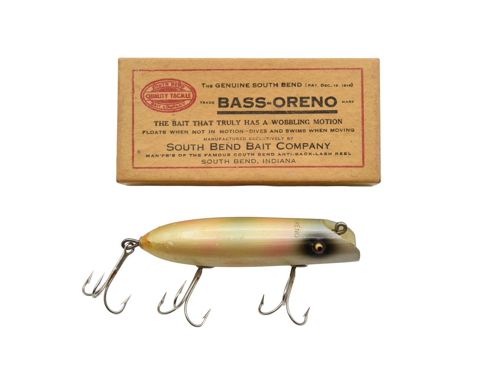 South Bend Bass-Oreno: Finished in tough pearl, good glass eyes, back stencil, about VG+ due mostly to hook marks, minor lip wear, added tail varnish, factory imperfection by one eye and age lines. The introductory Bass-Ore