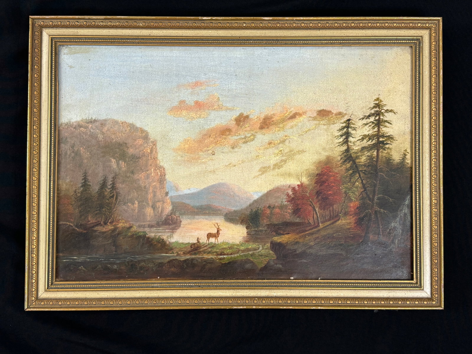 Adirondack Oil on Canvas Painting with Deer: Mountain lake scene, unsigned, as found condition, some crackling. 19 1/4" x 27 1/4"