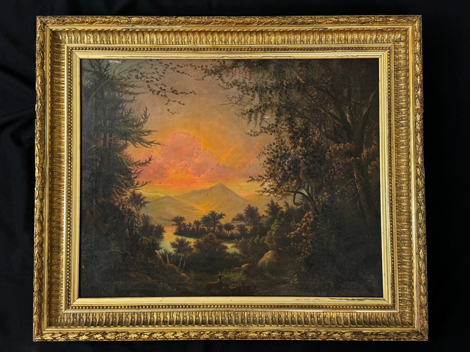 Oil on Canvas Mountain Lake Scene with Deer: original gold frame. There is a small repair in sky. 27" x 32 1/2"