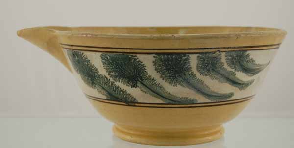Yelloware batter bowl with mocha green seaweed: 9 1/2" in diameter. As is condition. Chips, cracks and old repair.