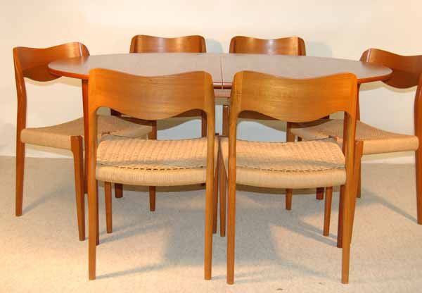 John Stuart Inc. Set of 6 Chairs & OvalTable: with 2 table leaves. Made in Denmark. Mid Century Modern. Table dimensions 59 1/4" long x 40" wide x 28 3/4". Two 12" table leaves.