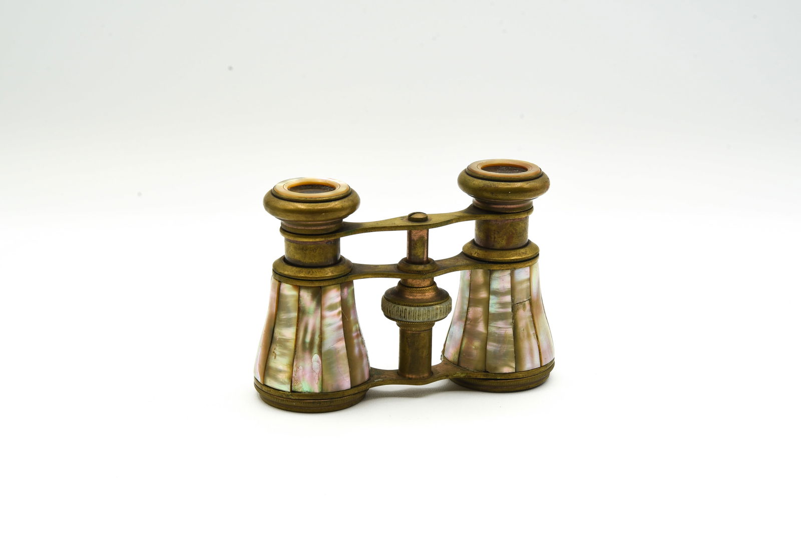 Mother of Pearl and Brass Opera Glasses: one piece of the mother of pearl is cracked.