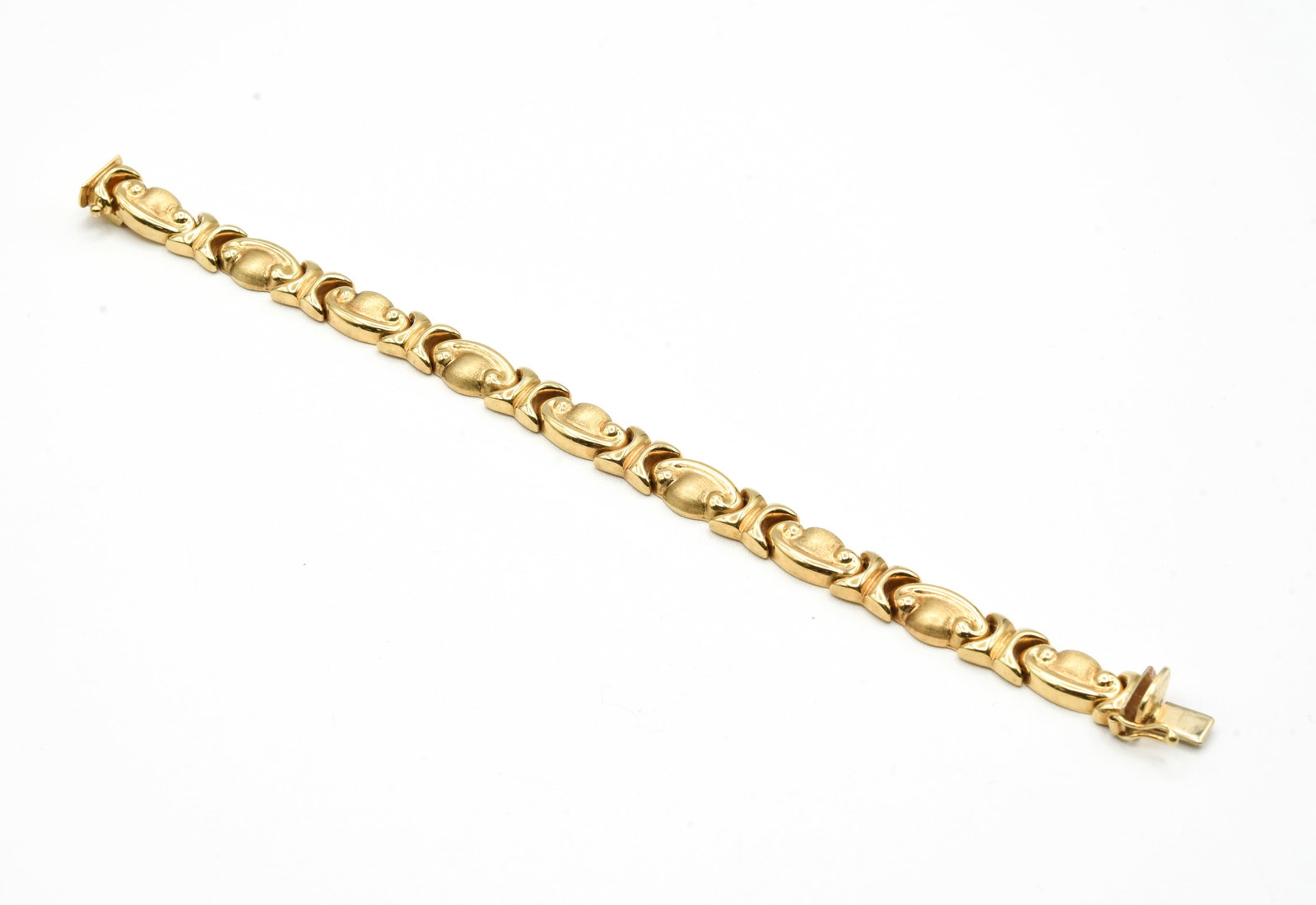 14kt Gold Hollow Fancy Stampado Style Bracelet: 7 1/4" and weighs 13.9 grams. It is 8.8mm wide.