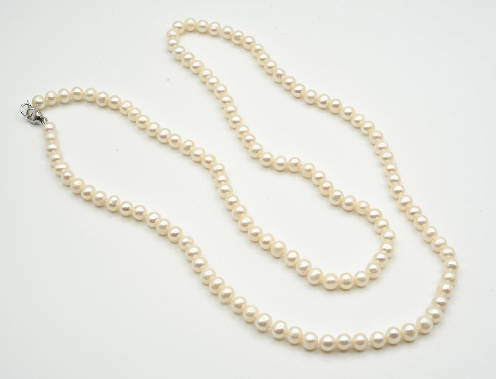 Fresh Water Pearls with Sterling Silver Clasp: 36 inches long.