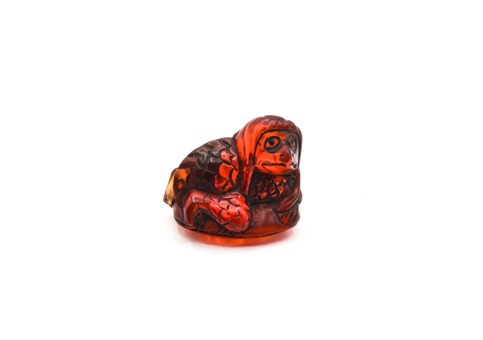 Red Amber Kappa Netsuke Signed: himotoshi on back, signature on bottom. 1 1/8" long.