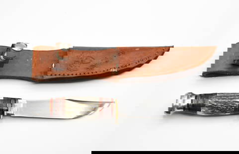 Custom Hunting Knife Made by Robert J Young: Robert Young was a former knife maker at the Marbles Factory in the 1950's. Comes with a leather sheath. 9 1/4" long.