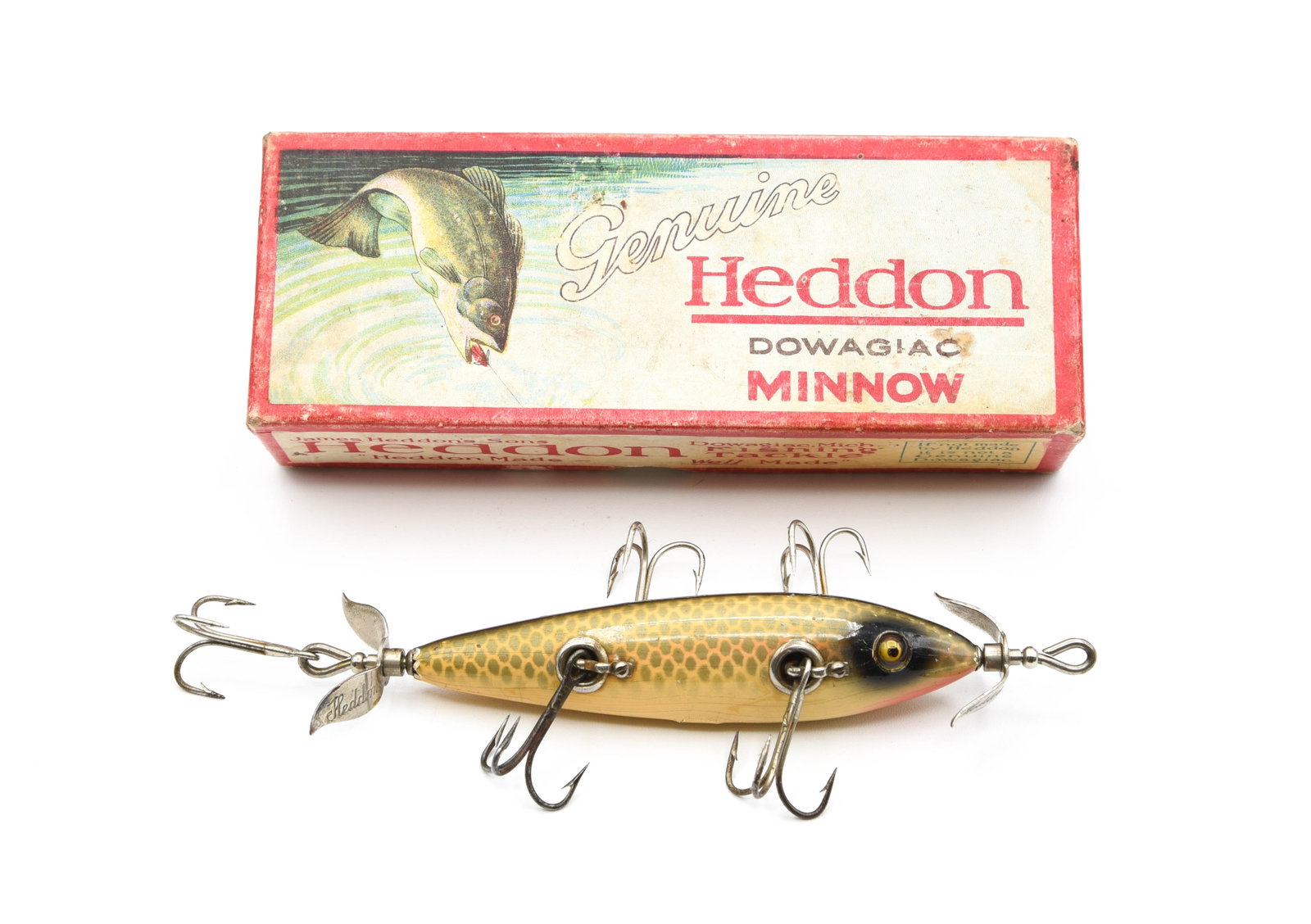 Heddon 150P Underwater Minnow: L-rig hardware, marked props, good glass eyes and finished in shiner scale, about VG+ with wear, tail/nose chipping, a few flakes, tiny touchups around the left eye and age lines, better than it sound