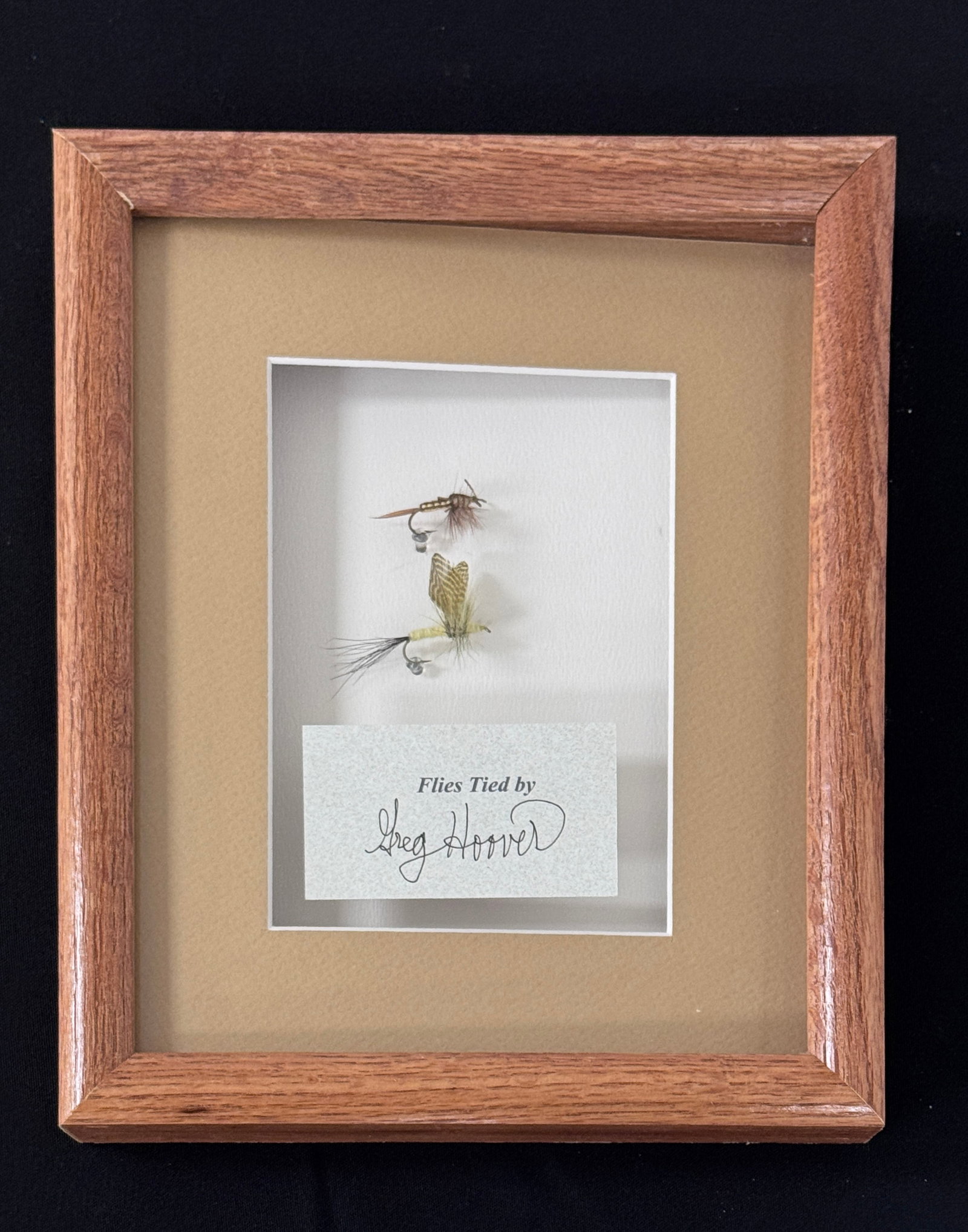 Framed Greg Hoover Flies: Tied by the late author Greg Hoover (1953-2023), an award winning tyer, conservationist, entomologist and life-long Pennsylvania fly fisherman. Both flies are pristine and unfished, housed in an 11" x