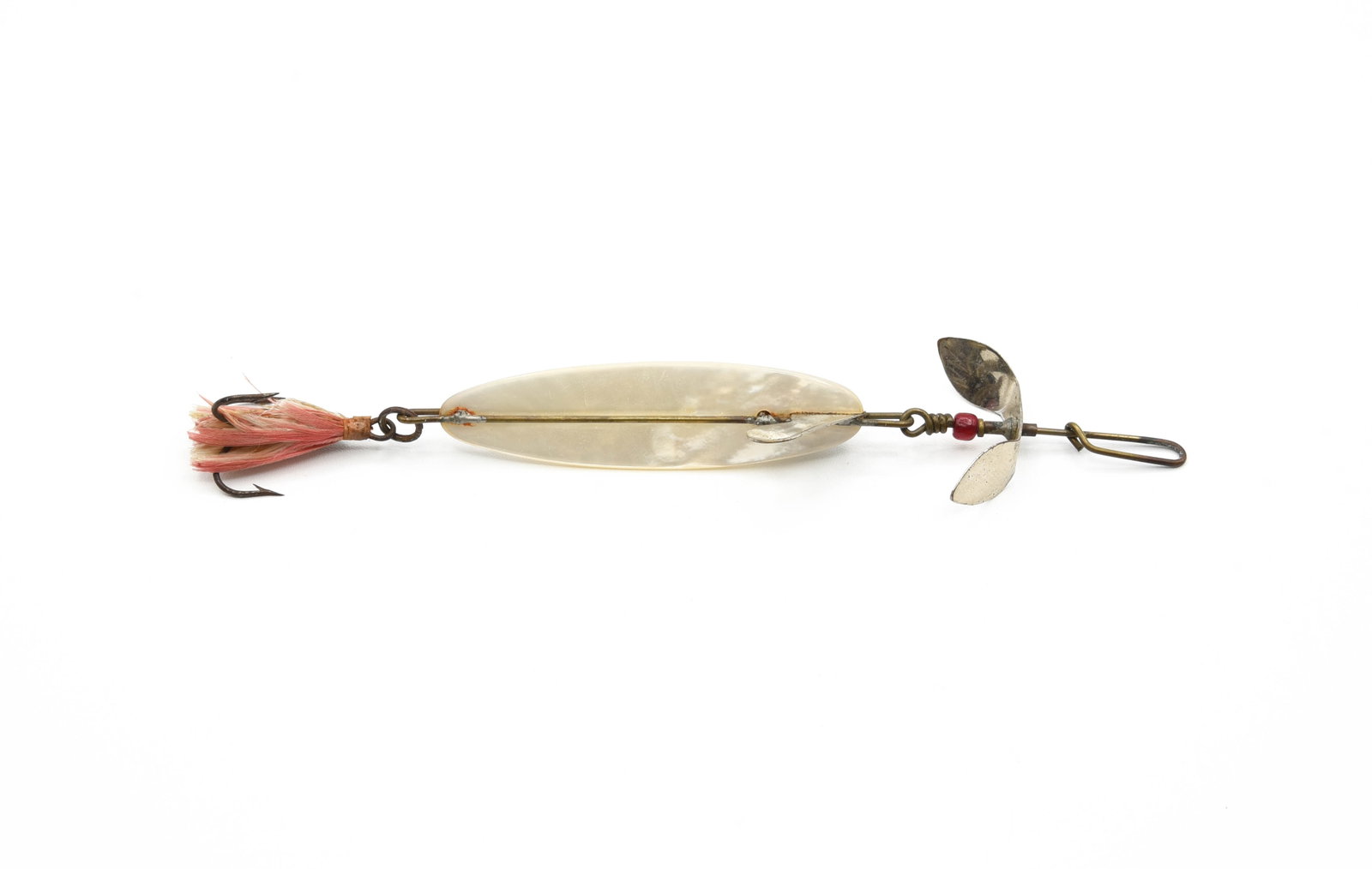 Early Haynes Pearl Magnet: Pearl body measures just under 3" in length and retains its original front prop, wire harness and red glass bead spacer, Ex-/Ex.