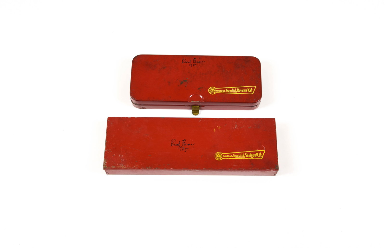 Fred Bear Signed Outer's Gun Kits: Outers Gunslick cleaning kits, each hand signed "Fred Bear 1985" on the top in black, owned and used by the legendary inventor and founder of Bear Archery. The largest measuring 13 3/4" in length, bot