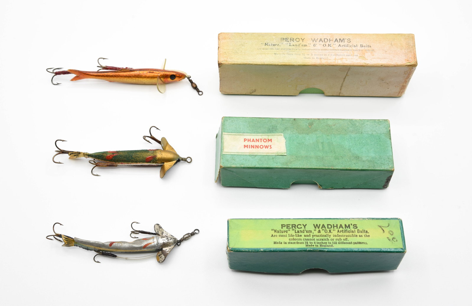 Percy Wadham's Baits & Phantom: Percy Wadham's marked boxes (6 1/8", 4 3/4"), the larger with a Swimmer Golden Sprat 3 1/2" label, the smaller with a Smelt 4" label, grading rough and Ex-. The lures are most likely unfished, but som