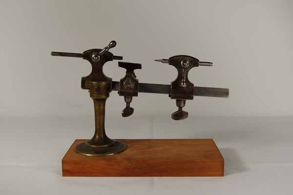 Early Watchmaker's / Jewelers Tool - Brass & Iron: 7" long. Provenance: from an estate in Middlebury, VT along with a collection of clock, watchmakers and jewelers tools; numerous pocket watches & parts; early pocketwatch books & catalogs; machinist t