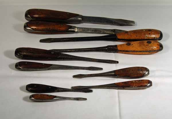 10 Steel and Wooden Handle Screw Drivers: including 2 with square shanks. Provenance: from an estate in Middlebury, VT along with a collection of clock, watchmakers and jewelers tools; numerous pocket watches & parts; early pocketwatch books 