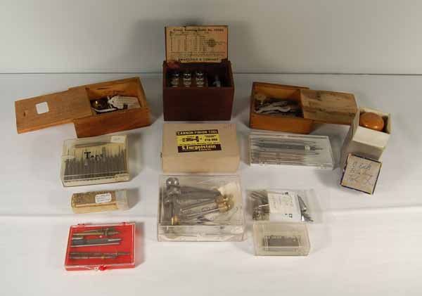 Clock, Watchmaker & Jewelers Tools: including a German Clock let down tool, Crown Reaming outfit in wooden box, clock bushing tool, cannon pinion tool, wrenches, taps, movement holder, balance staff remover and others. Provenance: from 